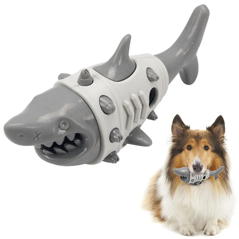 Blue, grey, and yellow shark-tooth shaped dog chew toy with textured surfaces and venting holes.