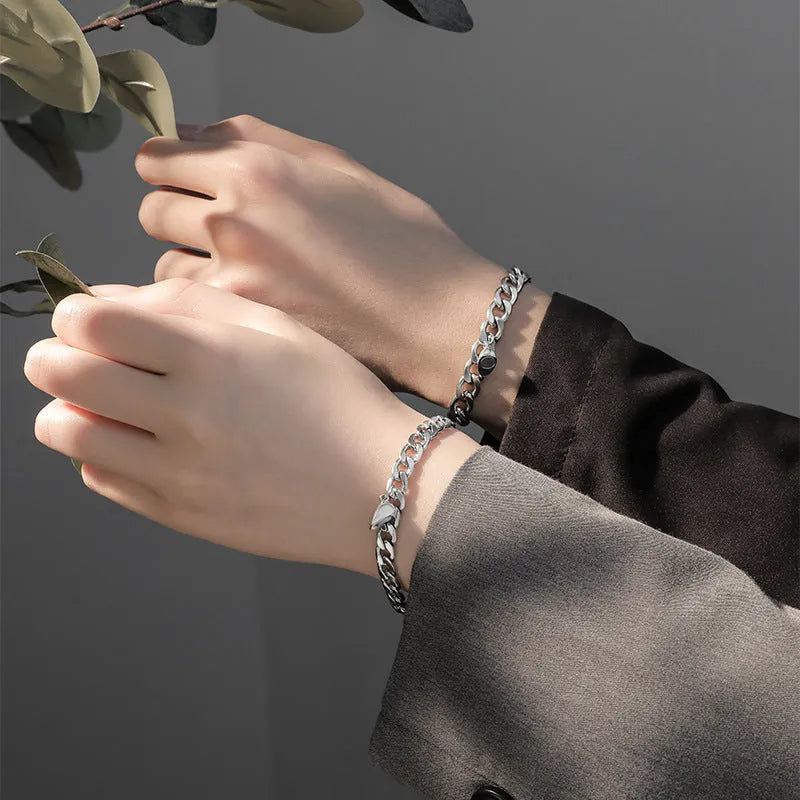 Silver magnetic couple bracelet with heart charm on stainless steel chain