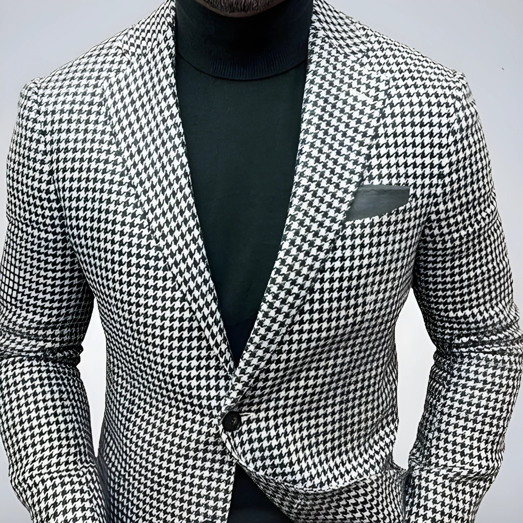 Men's slim fit two-button suit jacket with top-stitching pockets in a solid colour.