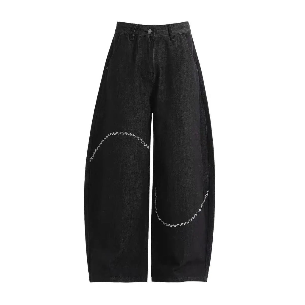 Black straight leg trousers with micro-elastic denim fabric and zip fly opening