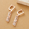 Two-tone rectangular hollow stud earrings for women, made from alloy with an electroplated finish.