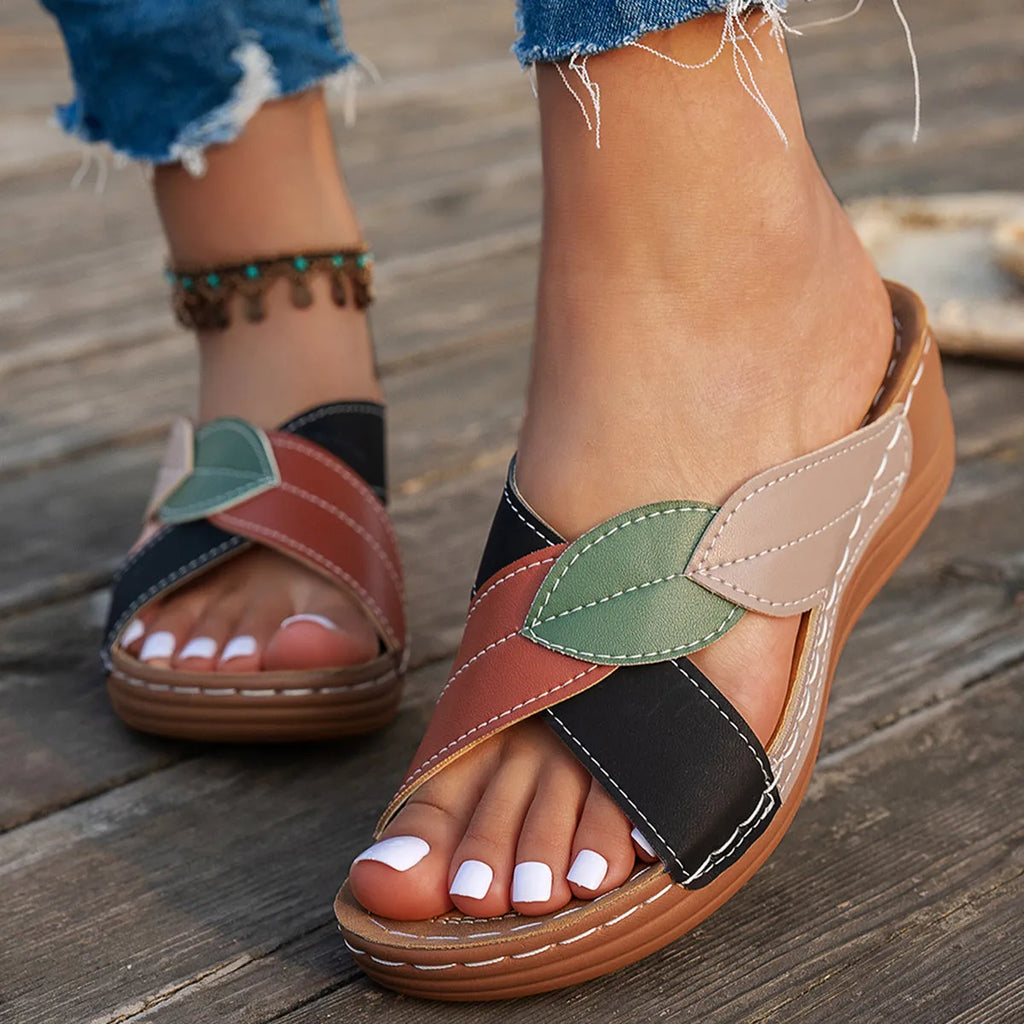 Women's red-brown cork wedge sandals with leaf design and gladiator lace-up ankle strap