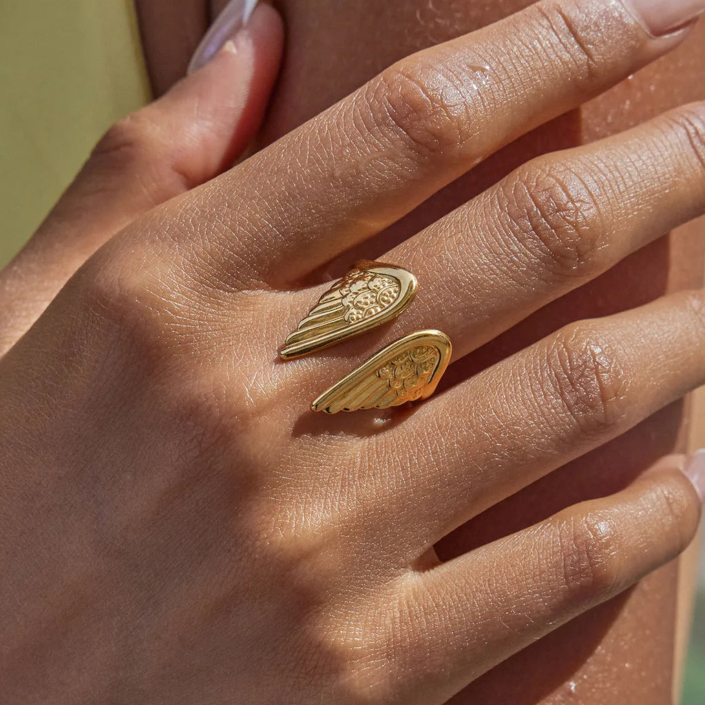 Stainless steel adjustable ring with wings design and non-fading electroplated finish.