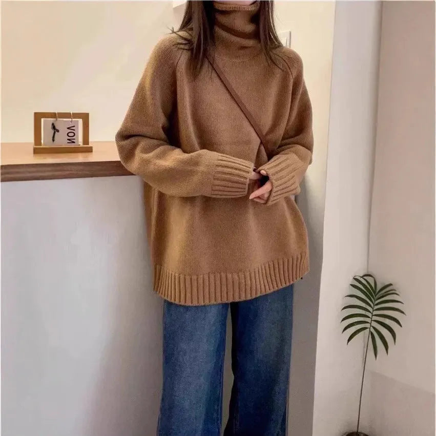 Women's thick loose-fit turtleneck sweater with curling pile collar in red, camel, grey, or black.