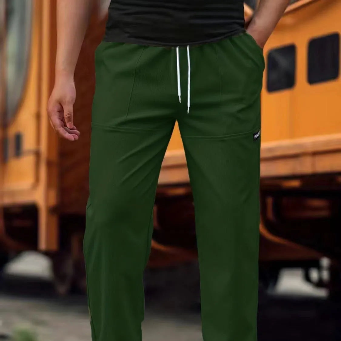 Men's casual polyester trousers for spring and autumn in light grey colour.