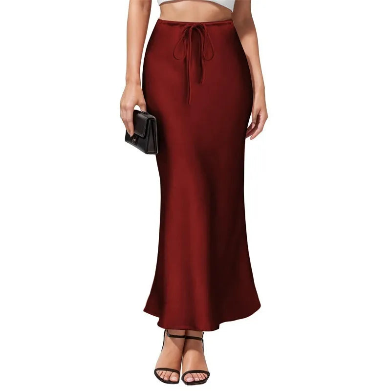 Asymmetric acetate satin skirt with high waist and irregular stitching detail in solid colour.