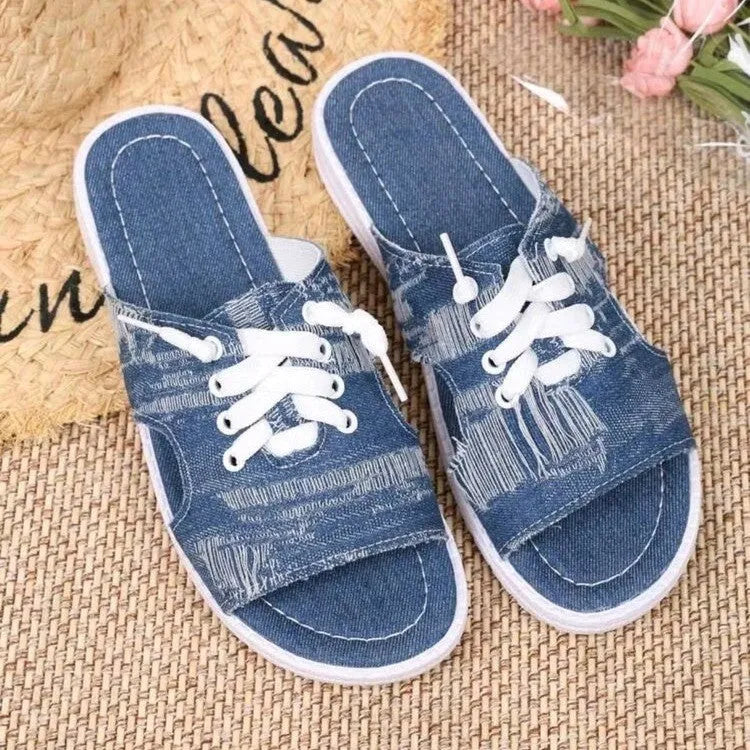 Blue Roman-style women's canvas slippers with rubber sole and cloth lining