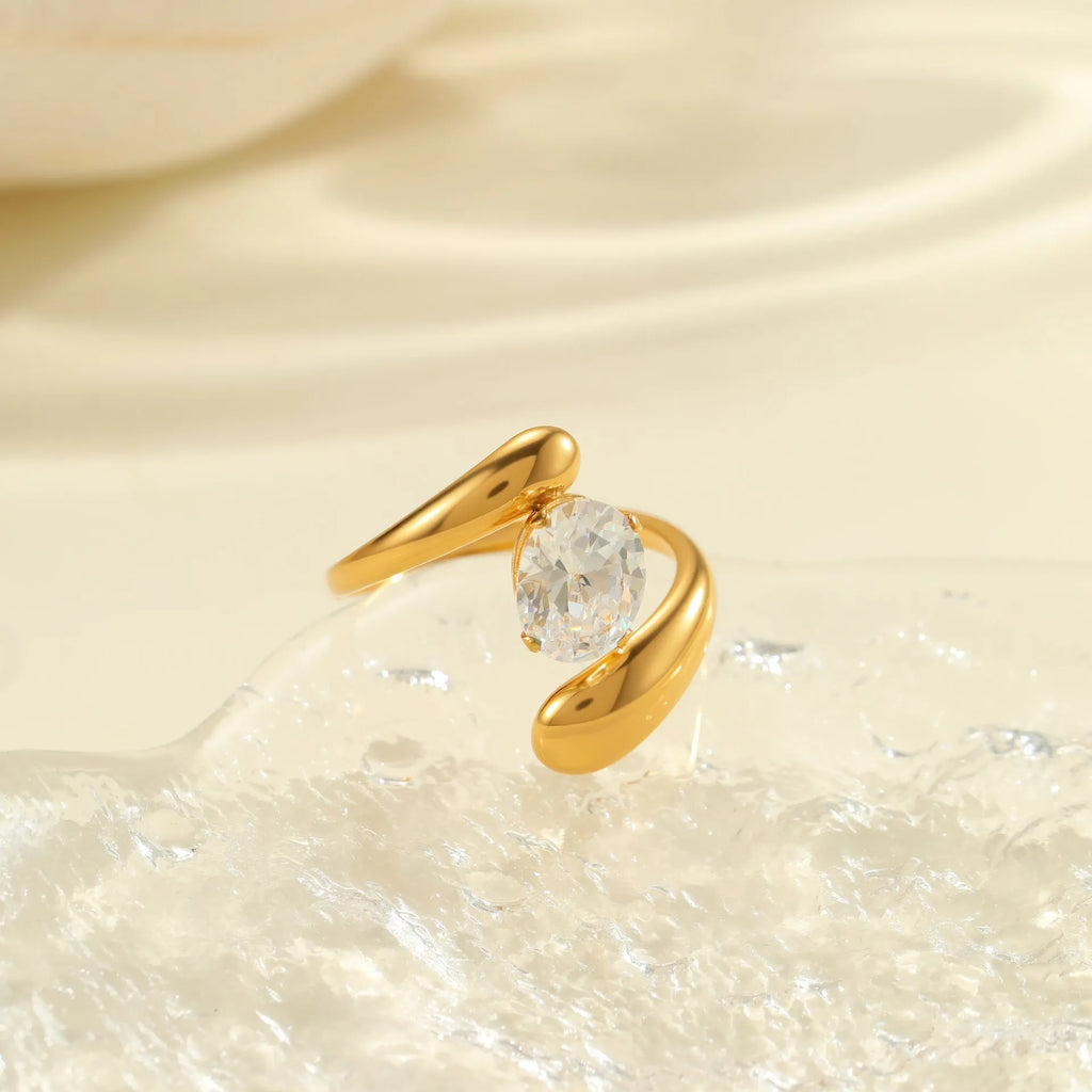 Geometric stainless steel zircon ring with open mouth design on a hand.