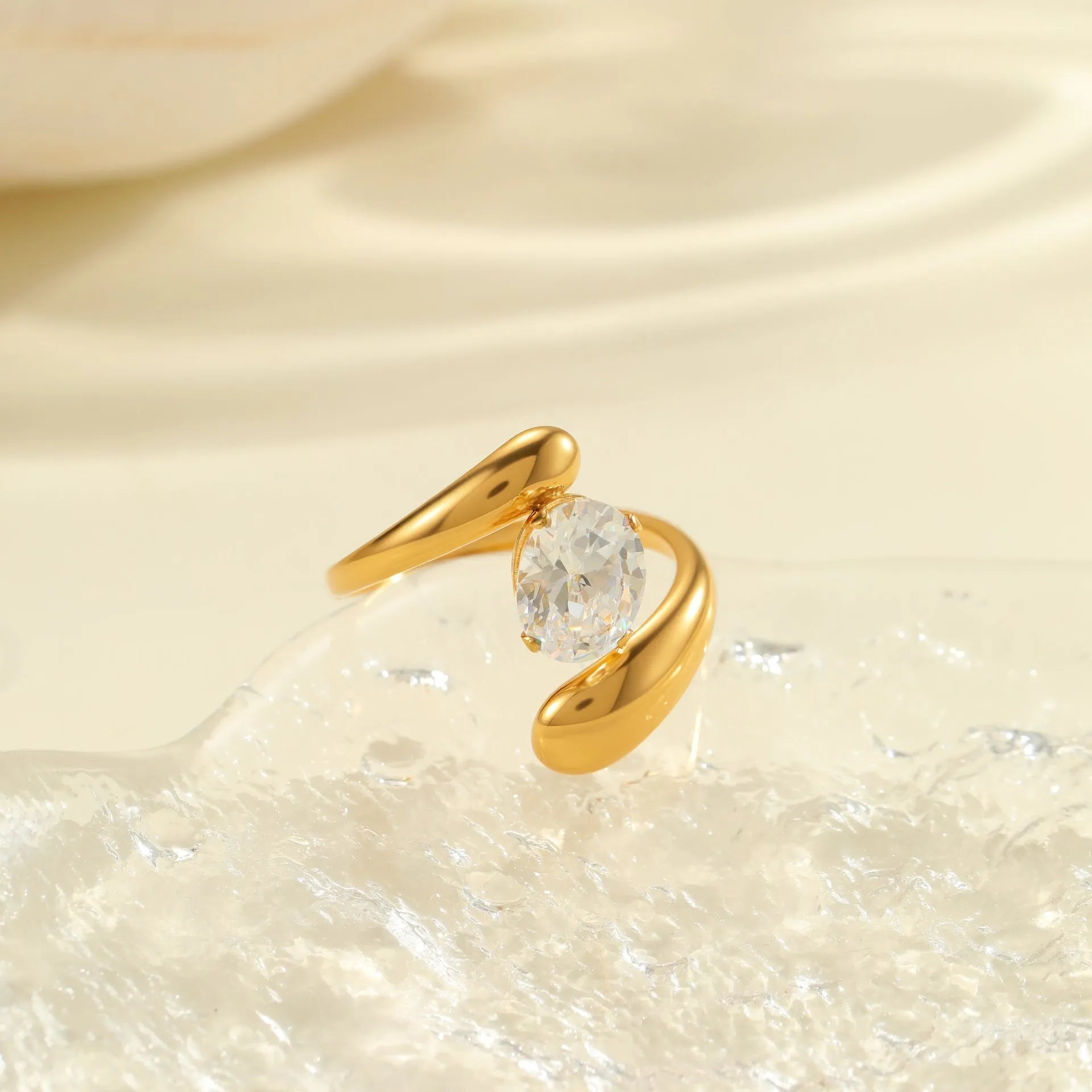 Geometric stainless steel zircon ring with open mouth design on a hand.
