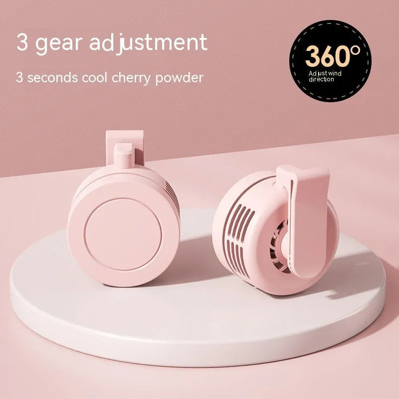 Green wrist hanging personal fan with light and USB charging port, shown with silicone neck strap.