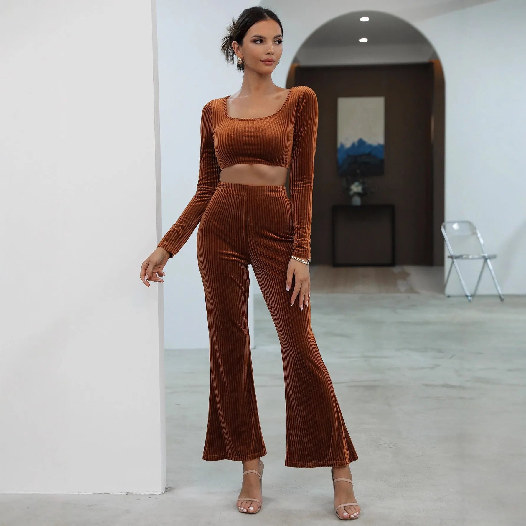 Caramel coloured long sleeve sweater and trousers casual set laid flat.