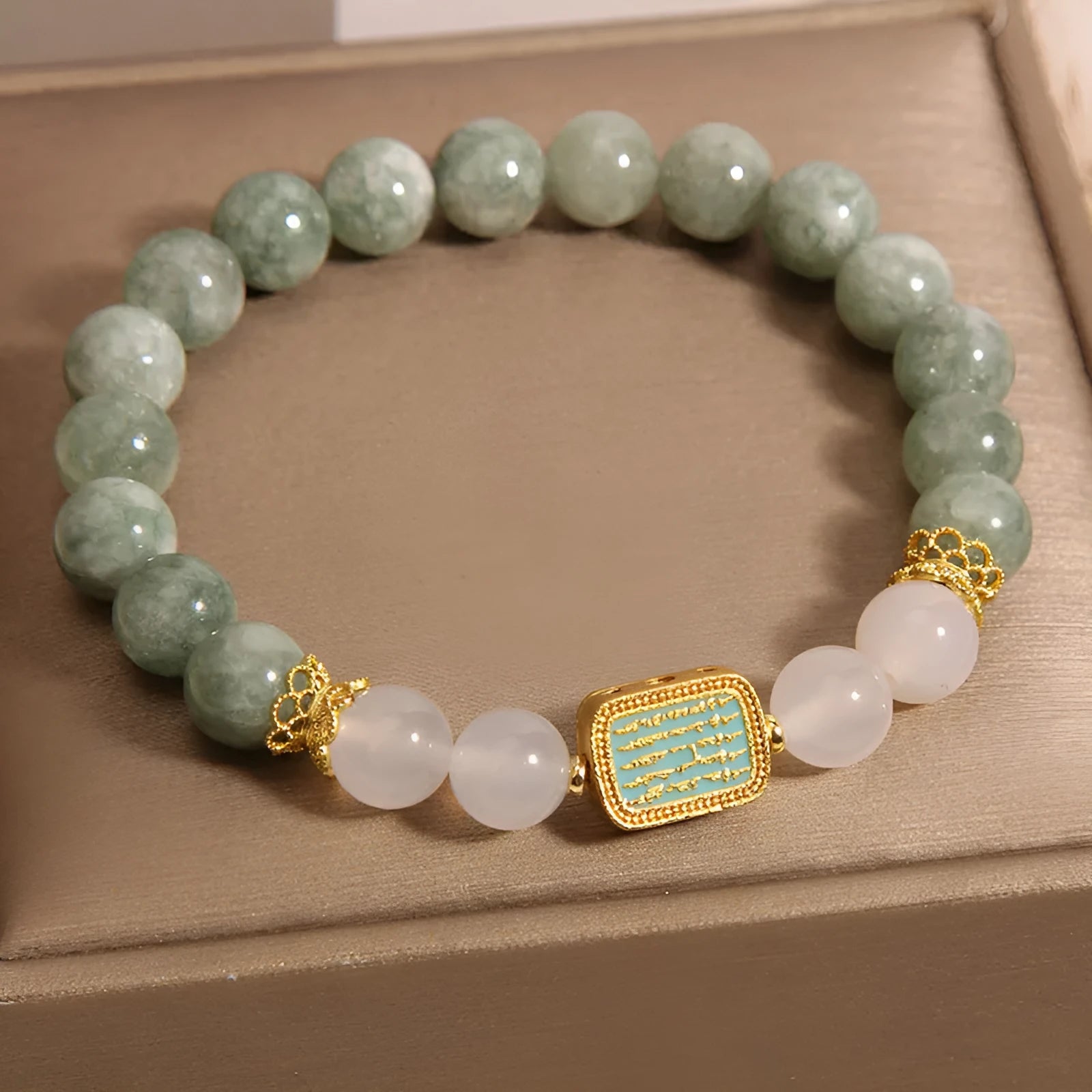 Women's oil green emerald crystal bracelet with five scriptures design on white background