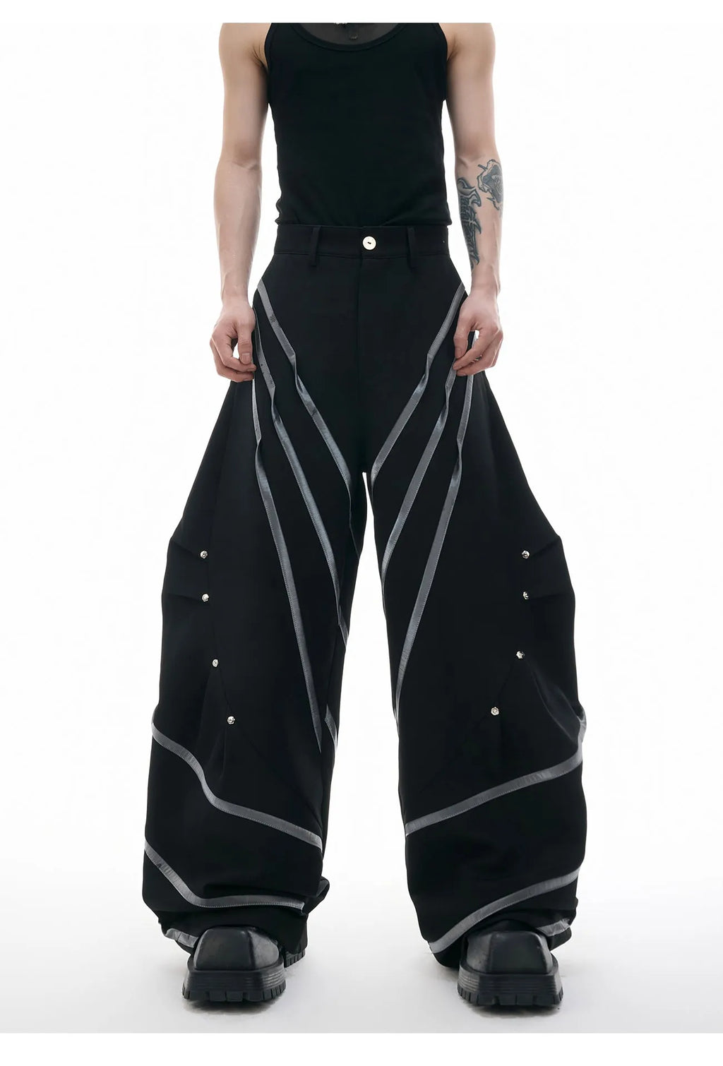 Men's trousers with metal striped rivet pleated design showing three-dimensional cutting detail