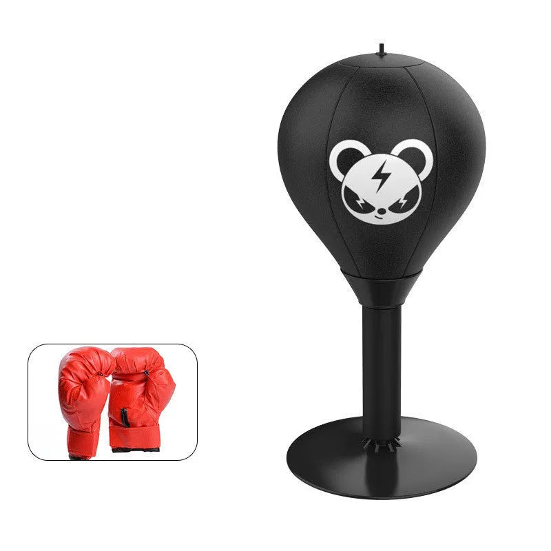 Tabletop boxing speed ball with suction cup base, inflatable PU leather sphere, and pump on a wooden desk.