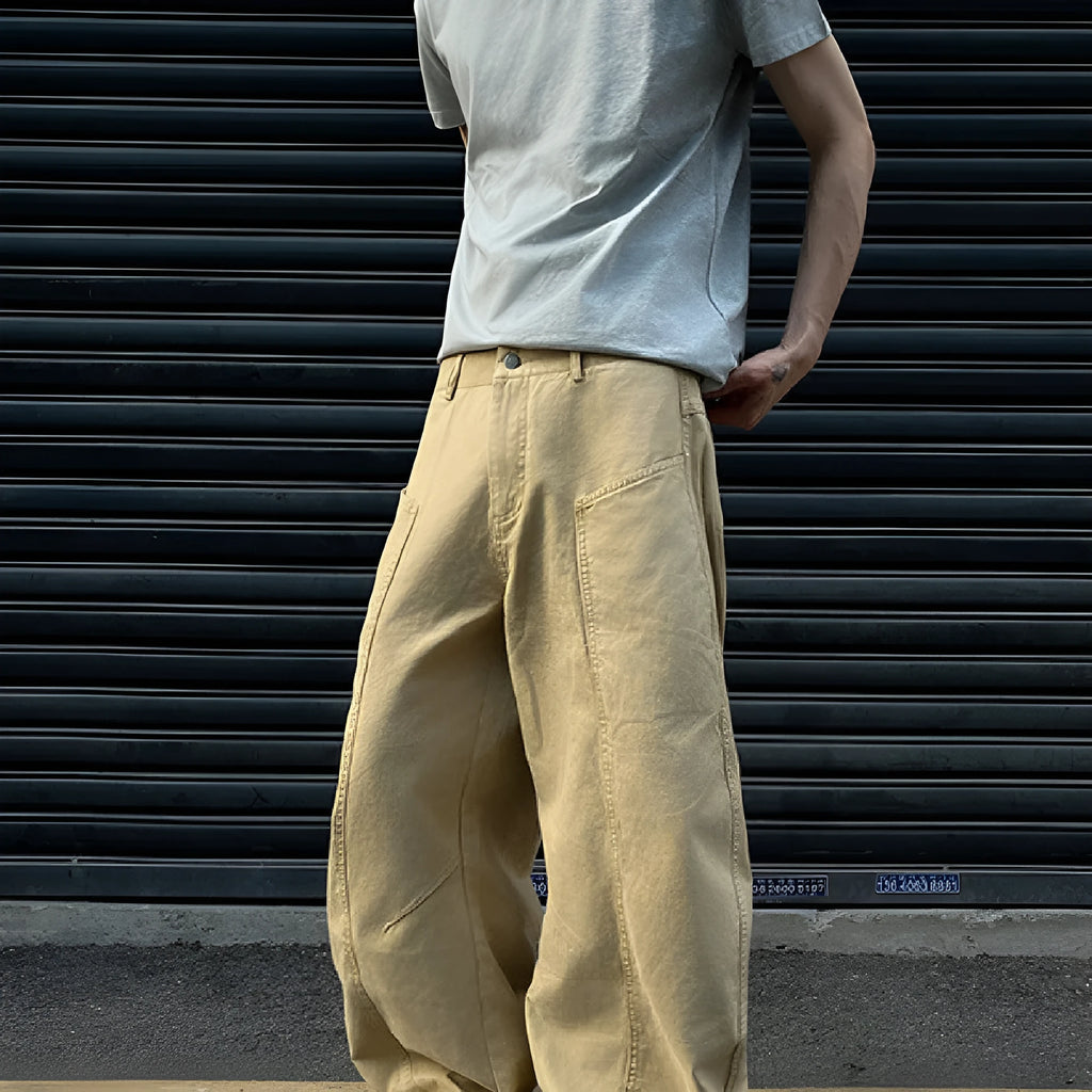 Men's khaki coloured straight-leg cotton casual trousers laid flat, showcasing the retro style and solid colour.