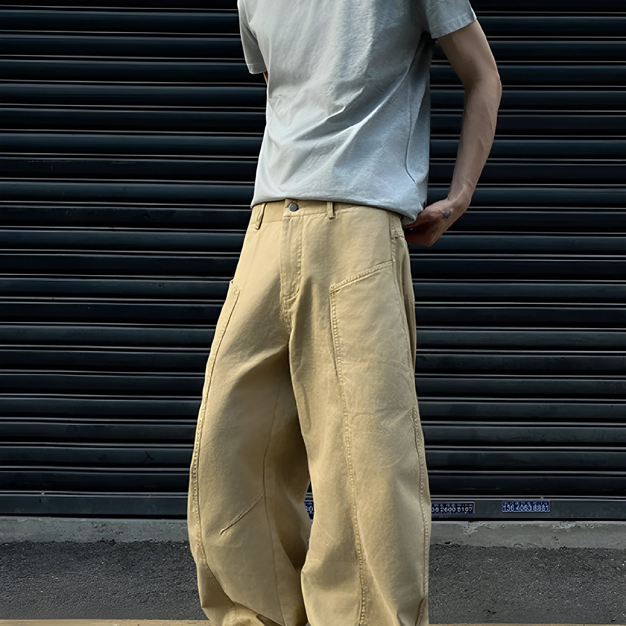 Men's khaki coloured straight-leg cotton casual trousers laid flat, showcasing the retro style and solid colour.