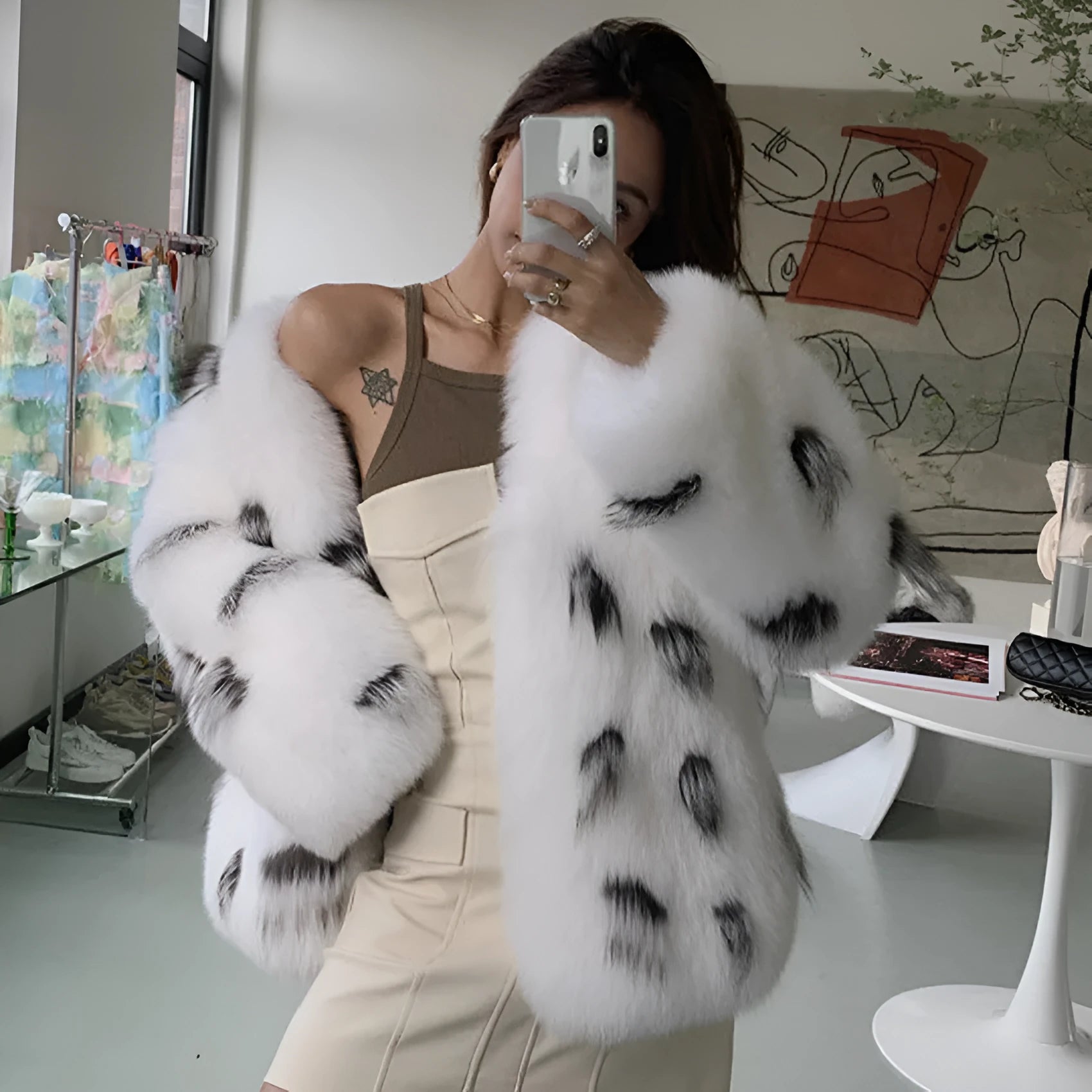Black and white faux fur women's coat with Korean-style slim fit and short length.