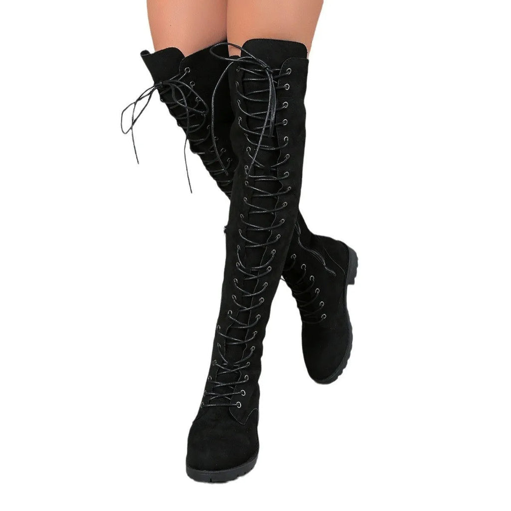Women's black lace-up over-the-knee boots with flat heel and round toe on a neutral background