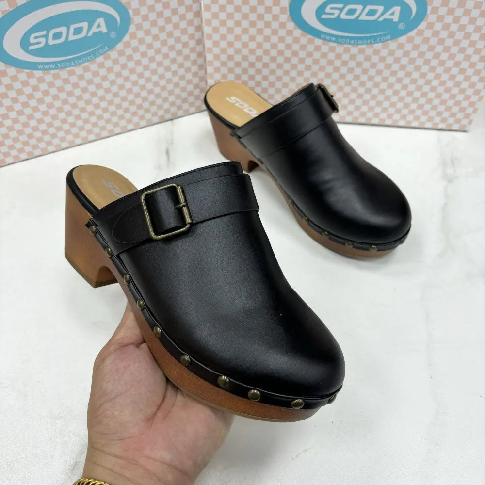 Women's black retro chunky heel slippers with rivet detail and a rubber sole.