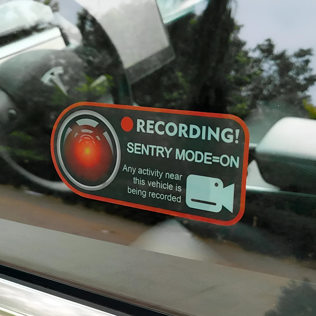 Pair of white rectangular electrostatic warning stickers for Tesla Sentry Mode, measuring 11cm by 5cm.
