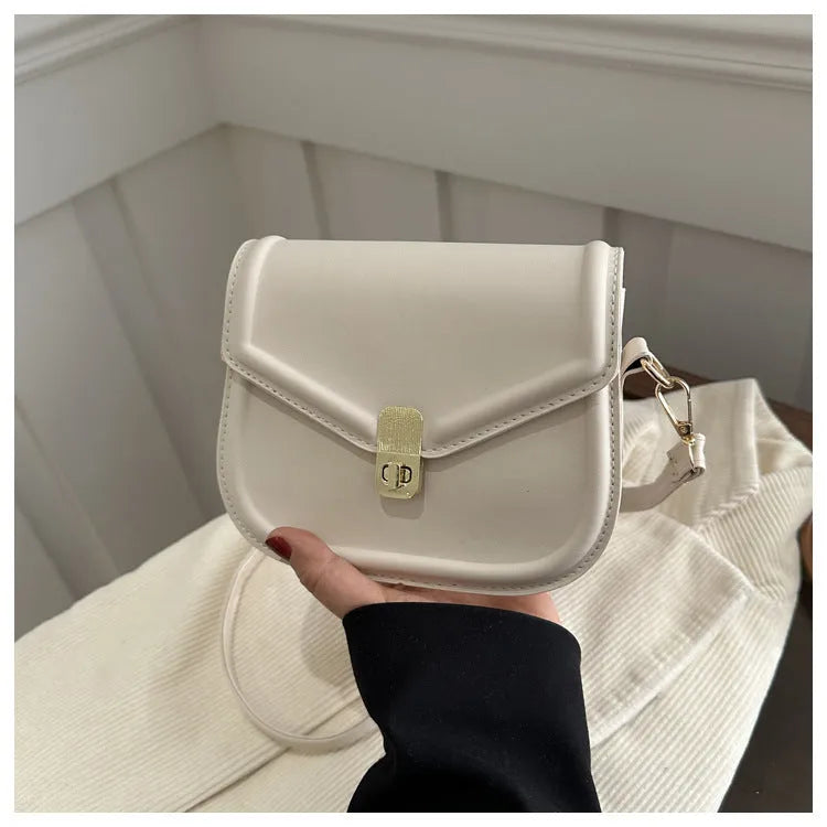 Soft PU leather horizontal square messenger bag with clamshell opening in khaki colour.