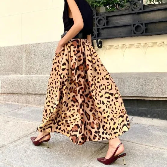 Women's brown leopard print A-line long skirt made from polyester fabric with an inelastic waist.