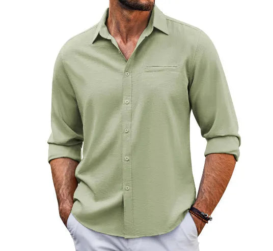 A man's solid-colour long sleeve casual shirt with a polo collar, button front, and chest pocket.
