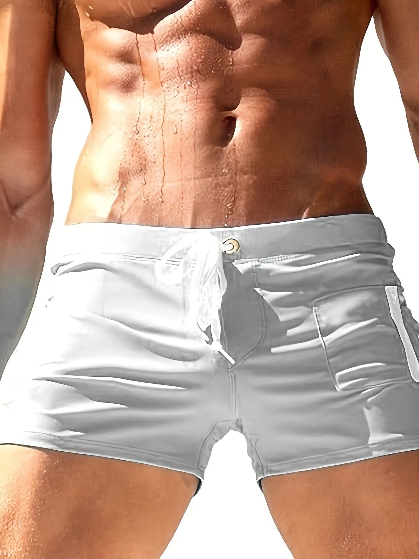 Men's black high-waist swimming trunks with a lace-up front, made from polyester and spandex.
