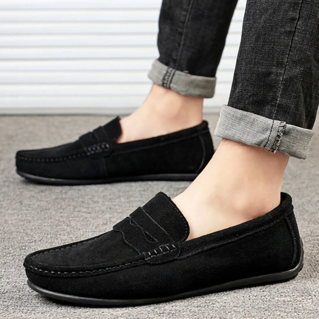 Men's suede loafers in black, blue, dark blue, wine red, and yellow colours showing round toe and flat sole