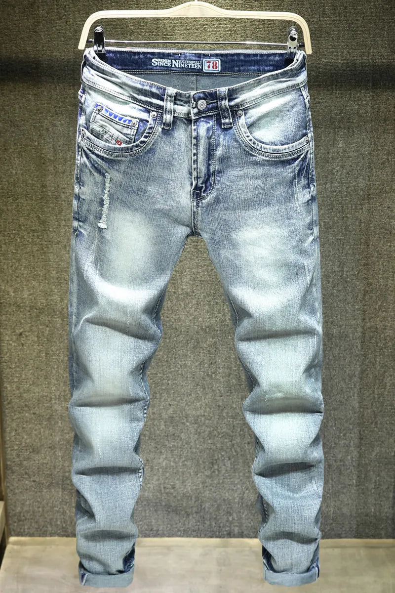 Men's light blue ripped casual jeans in cotton with distressed details, size 28 to 38