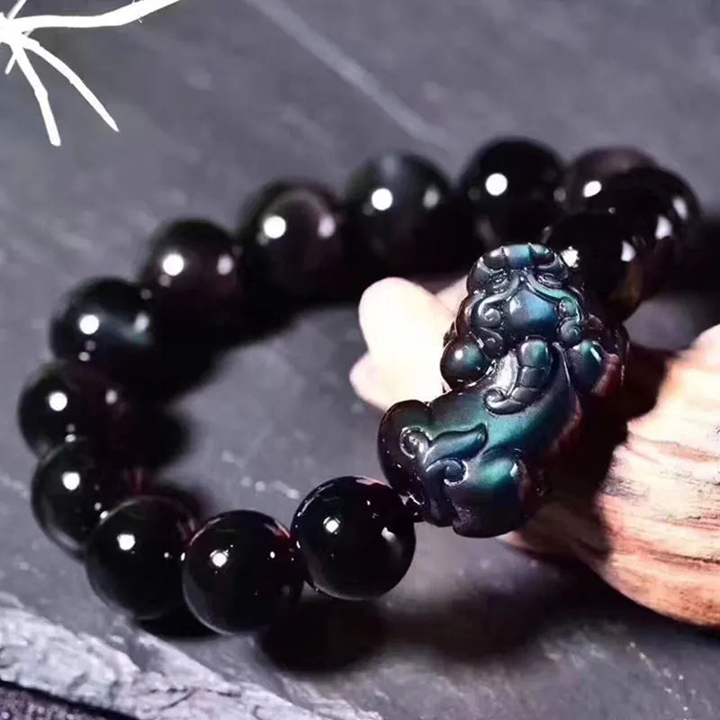 Natural ice colour Eye Obsidian crystal bracelet showing semi-translucent beads on wrist