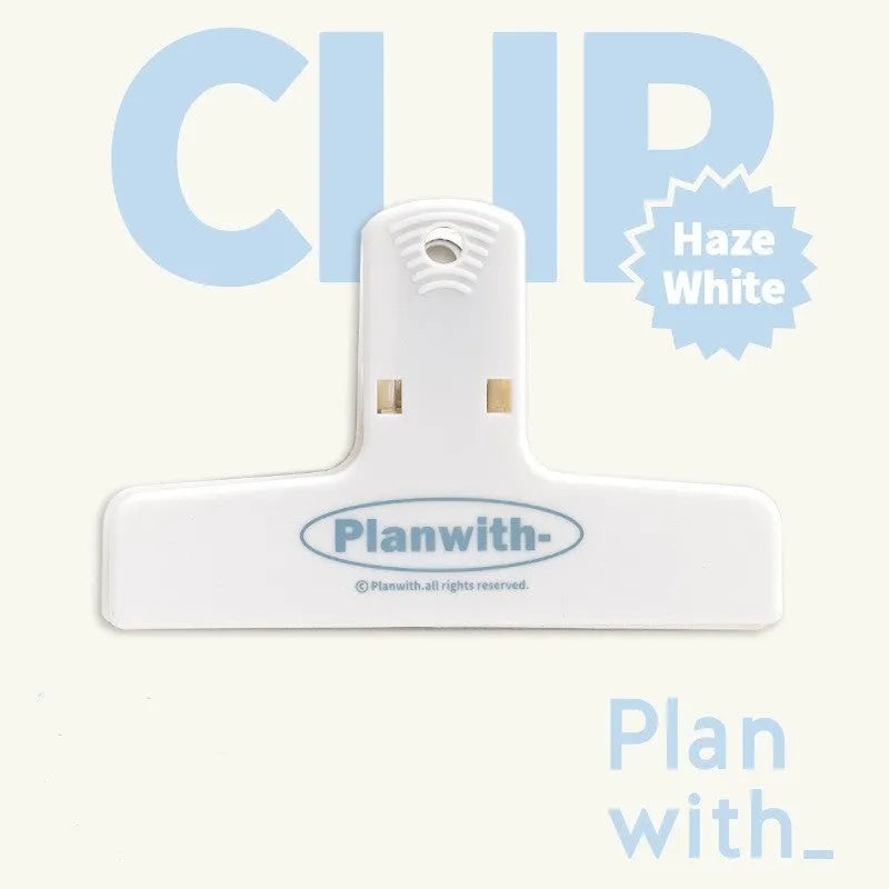 Blue and brown magnetic plastic bill clip holding paper tickets and receipts.