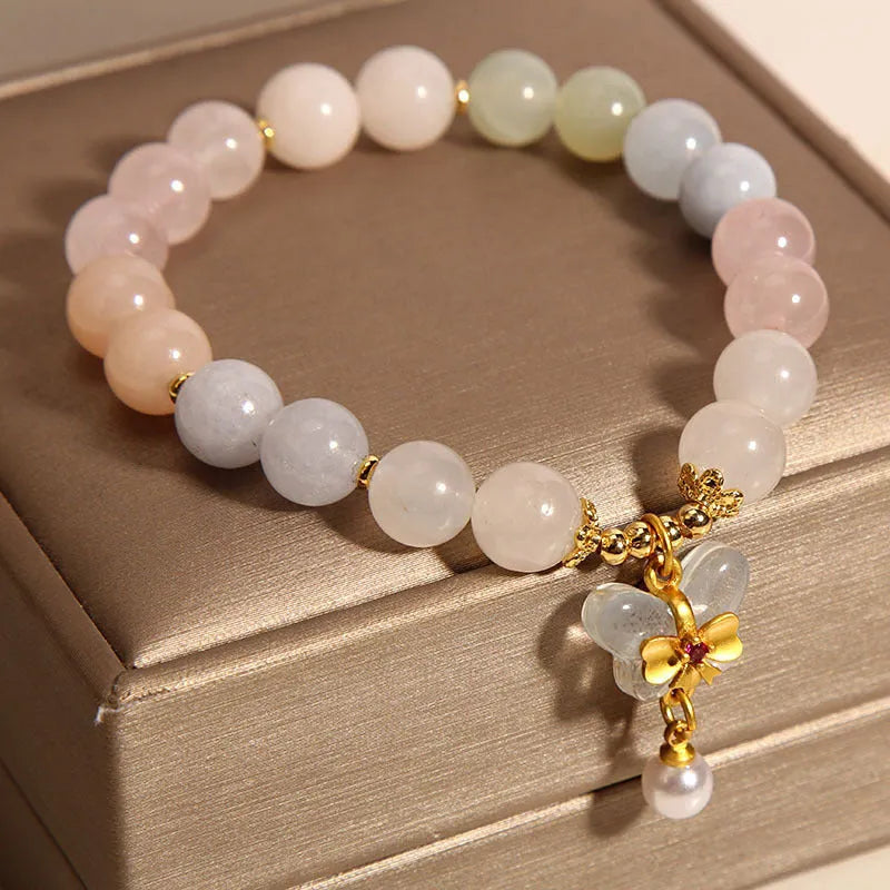 Crystal bracelet with natural Morganite butterfly pendant charm in candy colours on adjustable band