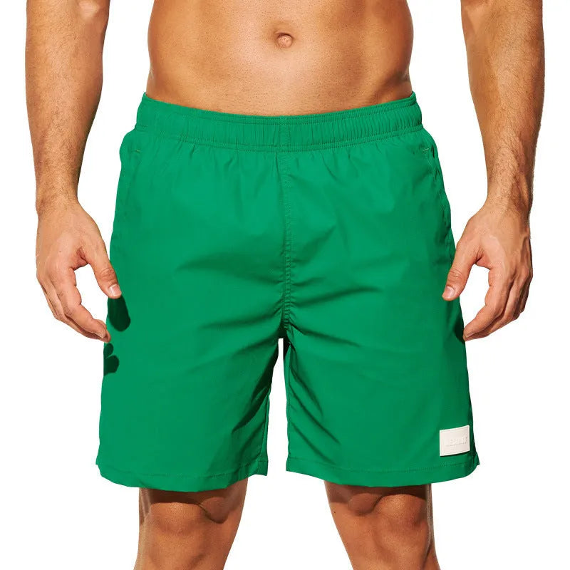 Men's quick-drying nylon sports shorts in blue with straight leg opening for beach and gym wear