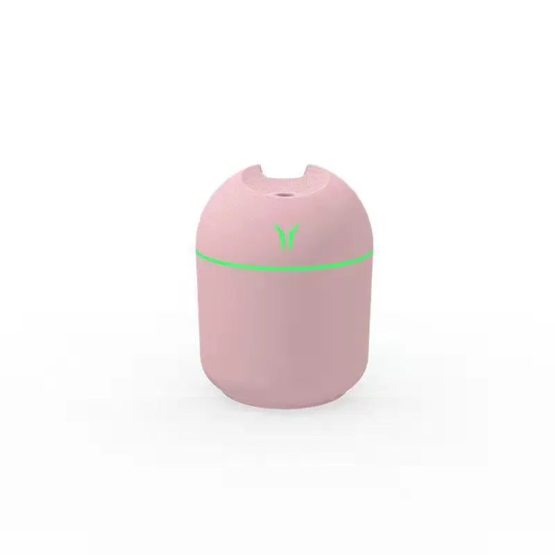 Round desktop humidifier in ivory white colour with USB cable and 250ml capacity marking