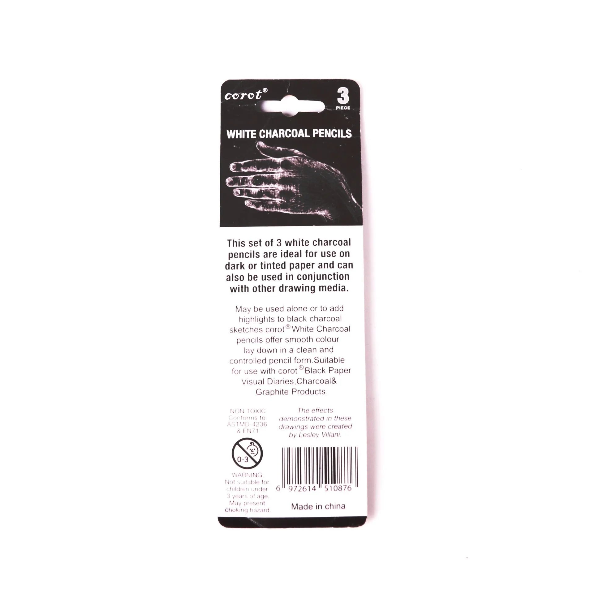 Three white charcoal sketching pencils with wooden barrels for highlighting on dark paper