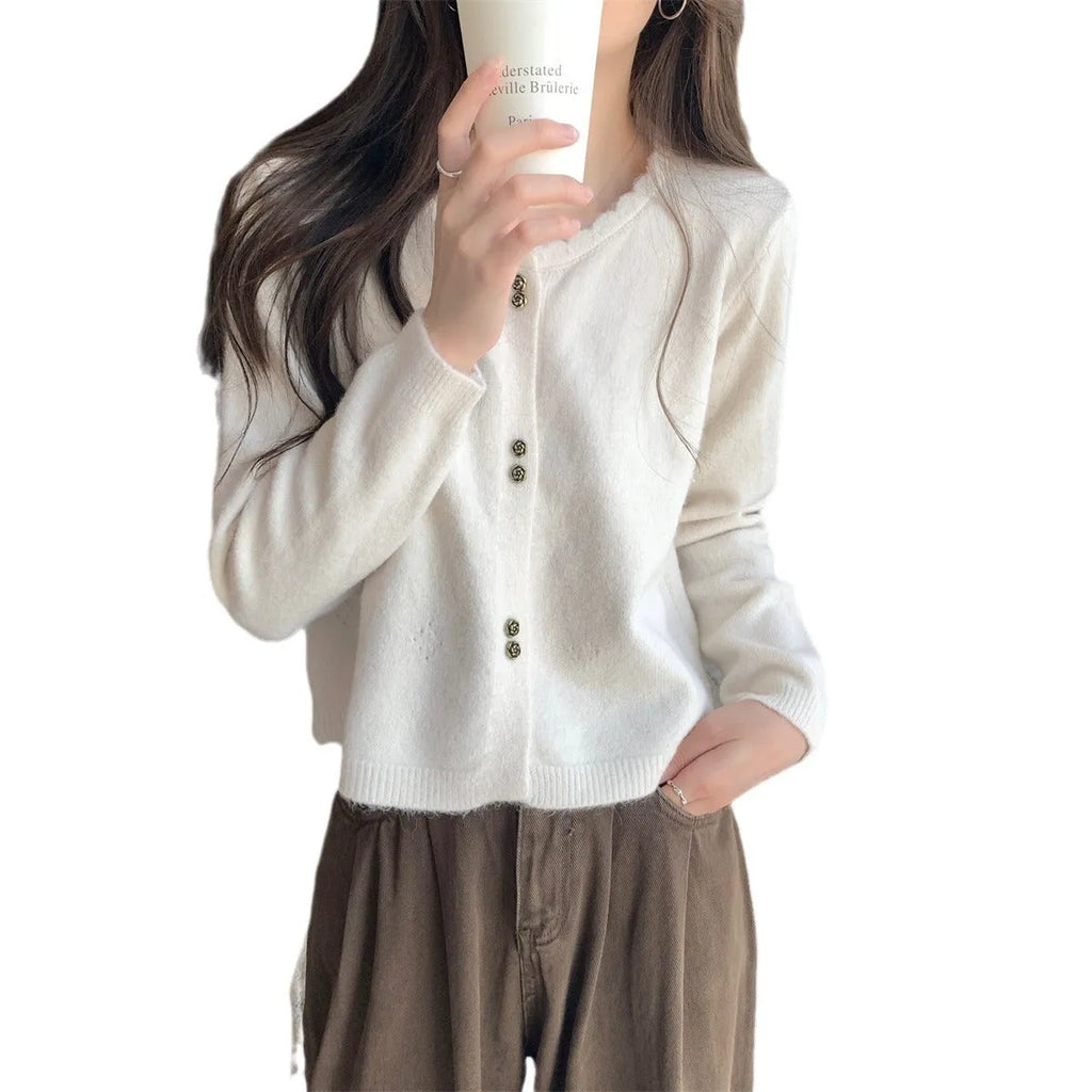 Women's long-sleeved acrylic cardigan coat in a solid colour, shown with a regular fit and cardigan front.