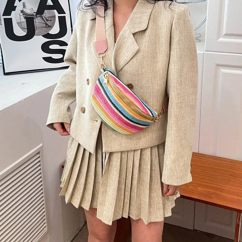 Bohemian style straw beach bag with woven construction, shell shape, and single shoulder strap