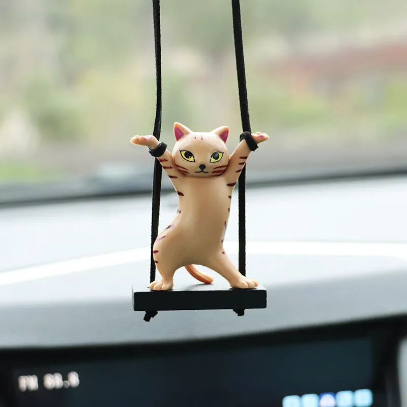 Resin cartoon cat pendant for car interior decoration on adjustable rope.