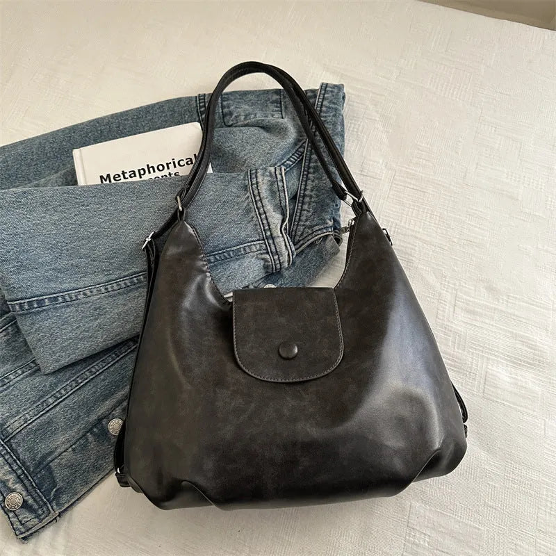 Women's PU leather shoulder bag in horizontal square shape with single strap, showing interior mobile phone compartment