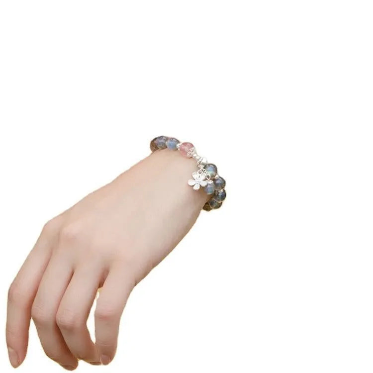 Grey moonlight gemstone women's bracelet with 7.5mm beads and a sterling silver honeysuckle charm.