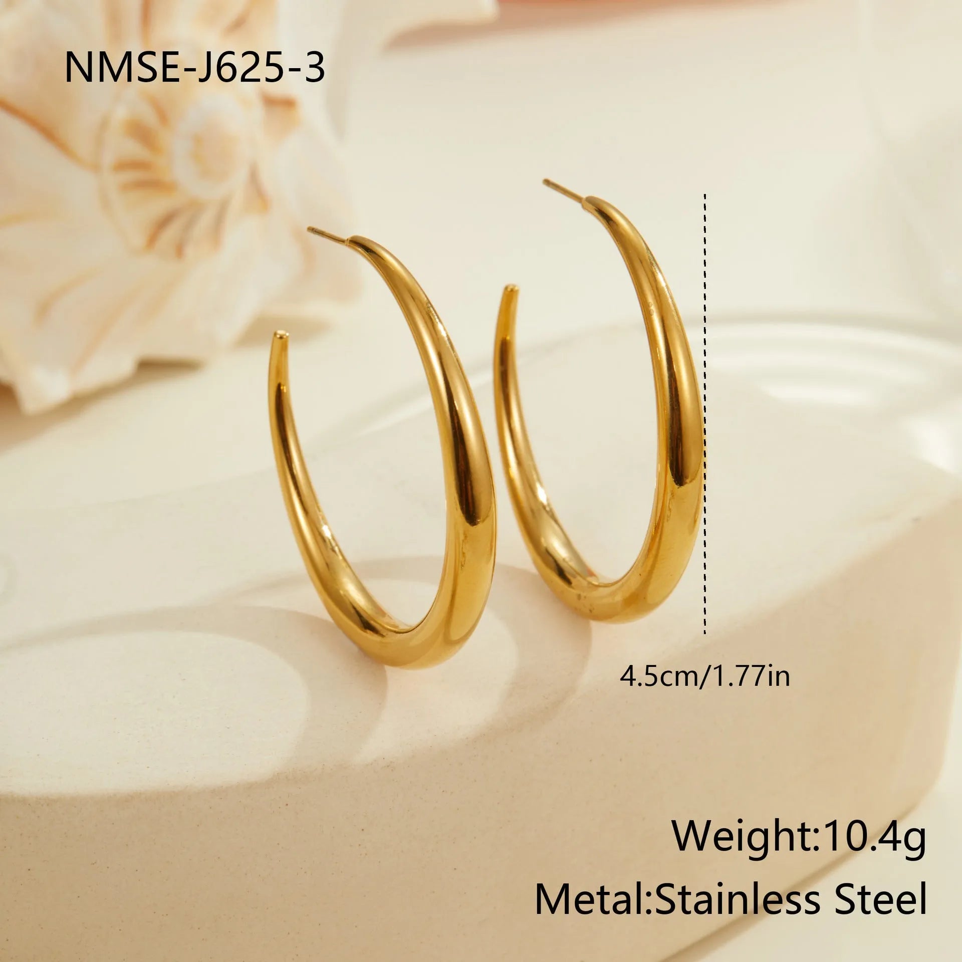 Simple round stainless steel hoop earrings for women in gold and steel colours, available in two sizes.