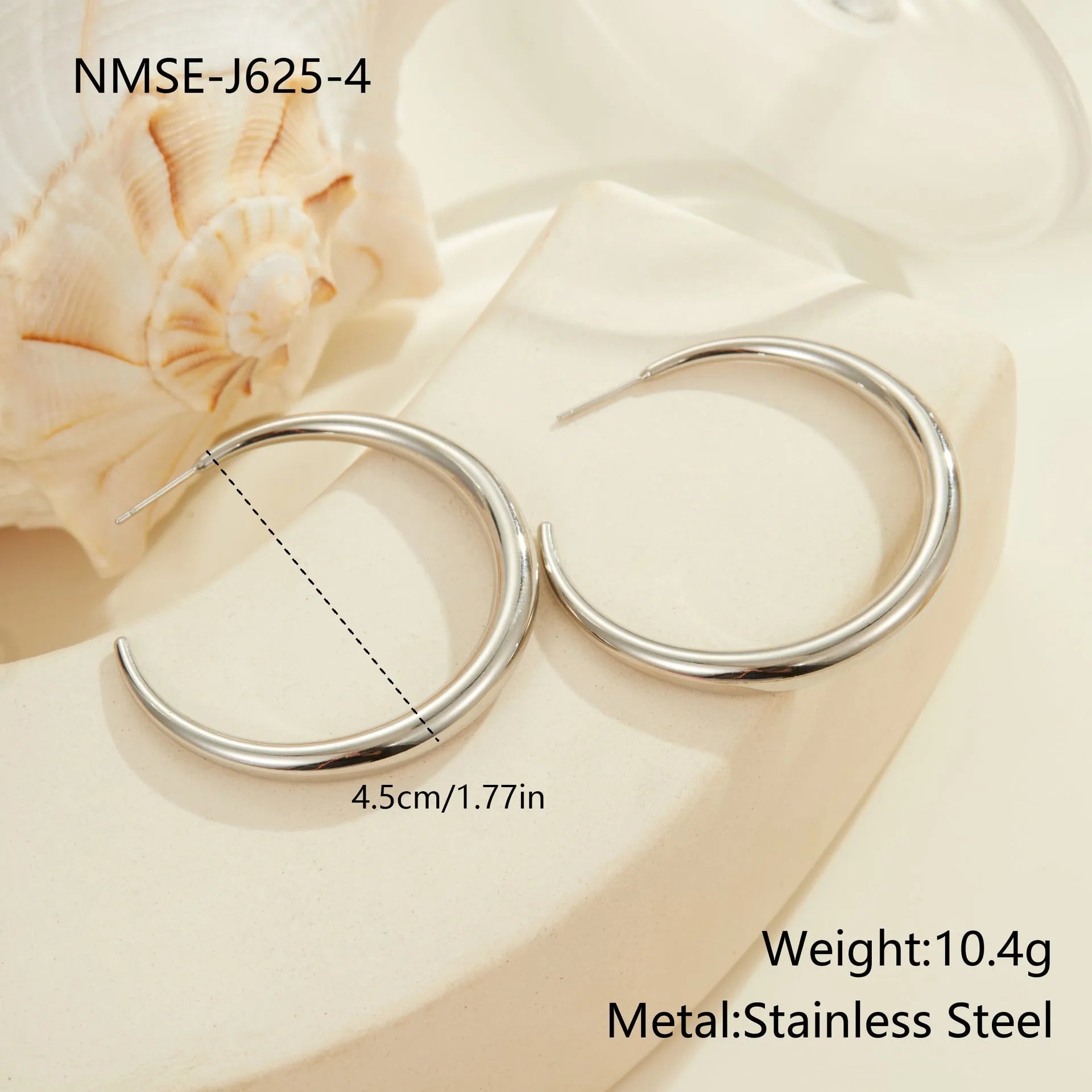 Simple round stainless steel hoop earrings for women in gold and steel colours, available in two sizes.