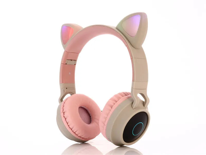 Cartoon-style pink wireless Bluetooth headset with cat ears on headband