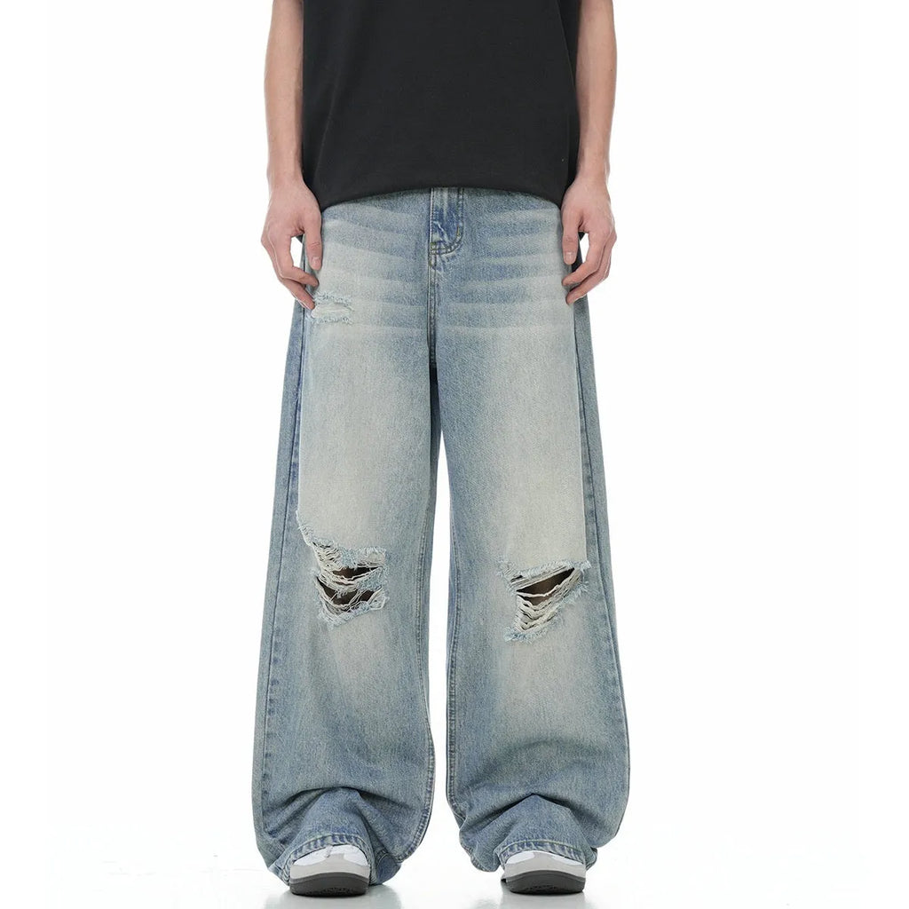 Blue men's straight-leg jeans with ripped knee detailing and a zipper fly