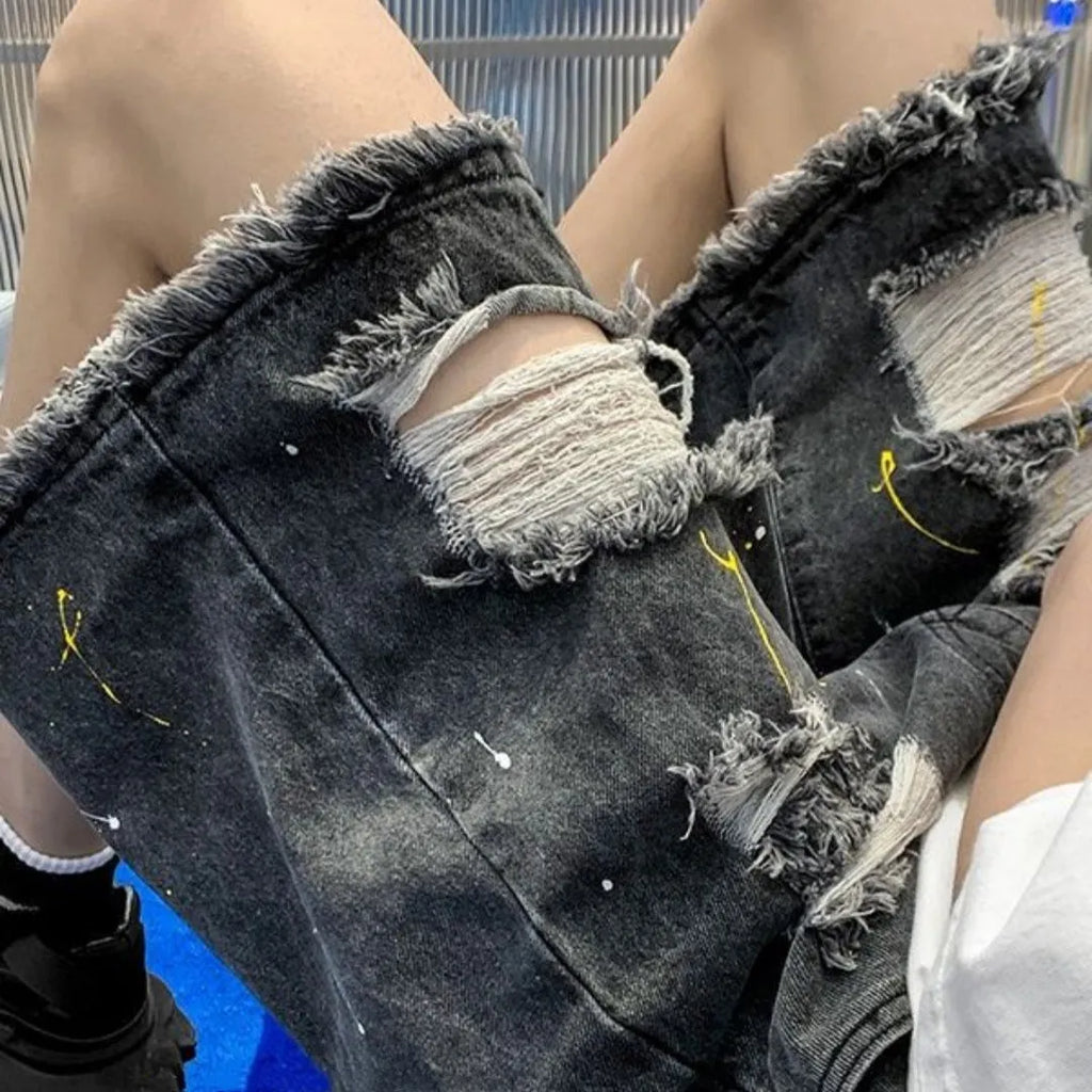 Men's black and light blue loose-fit water-washed denim shorts on a size chart.