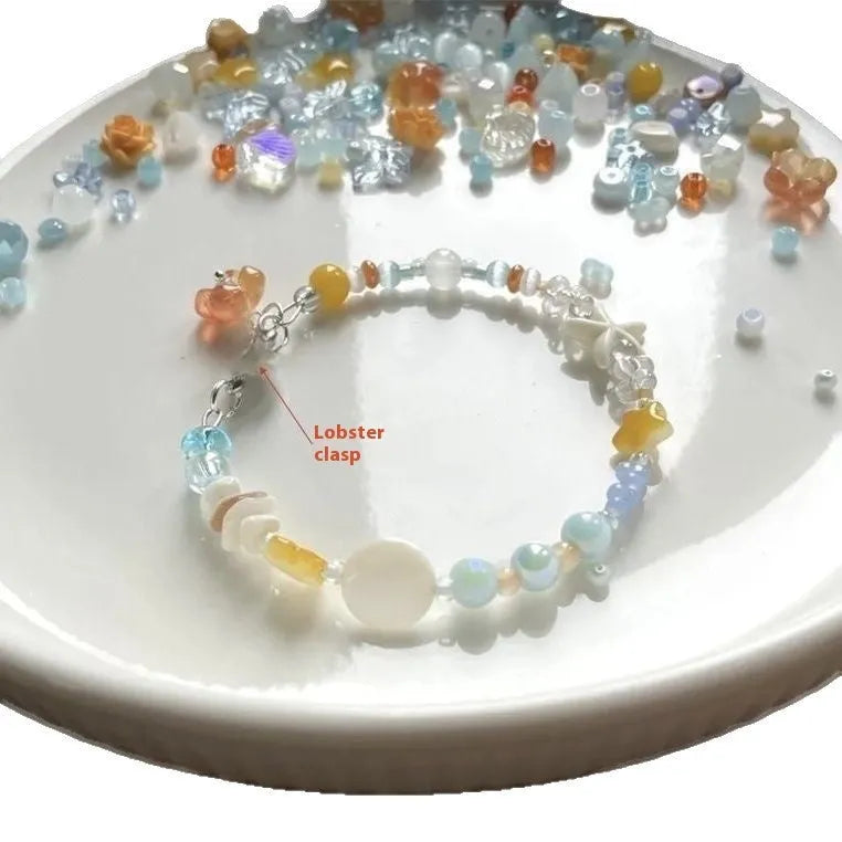 Orange alloy bracelet with diamond-shaped links and round decorative elements for women
