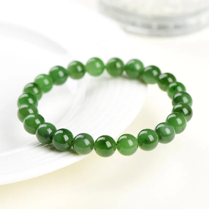 Natural jasper bead bracelet on wrist showing polished Hetian jade construction with multiple bead size options