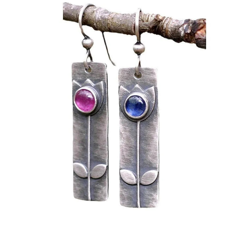 Geometric red sapphire earrings for women with an antique finish and ellipse details.