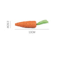 Set of assorted cat toys including fabric carrot bites, crinkly paper toys, ringing stones, feather-like sticks, and chewable tooth grinding sticks.
